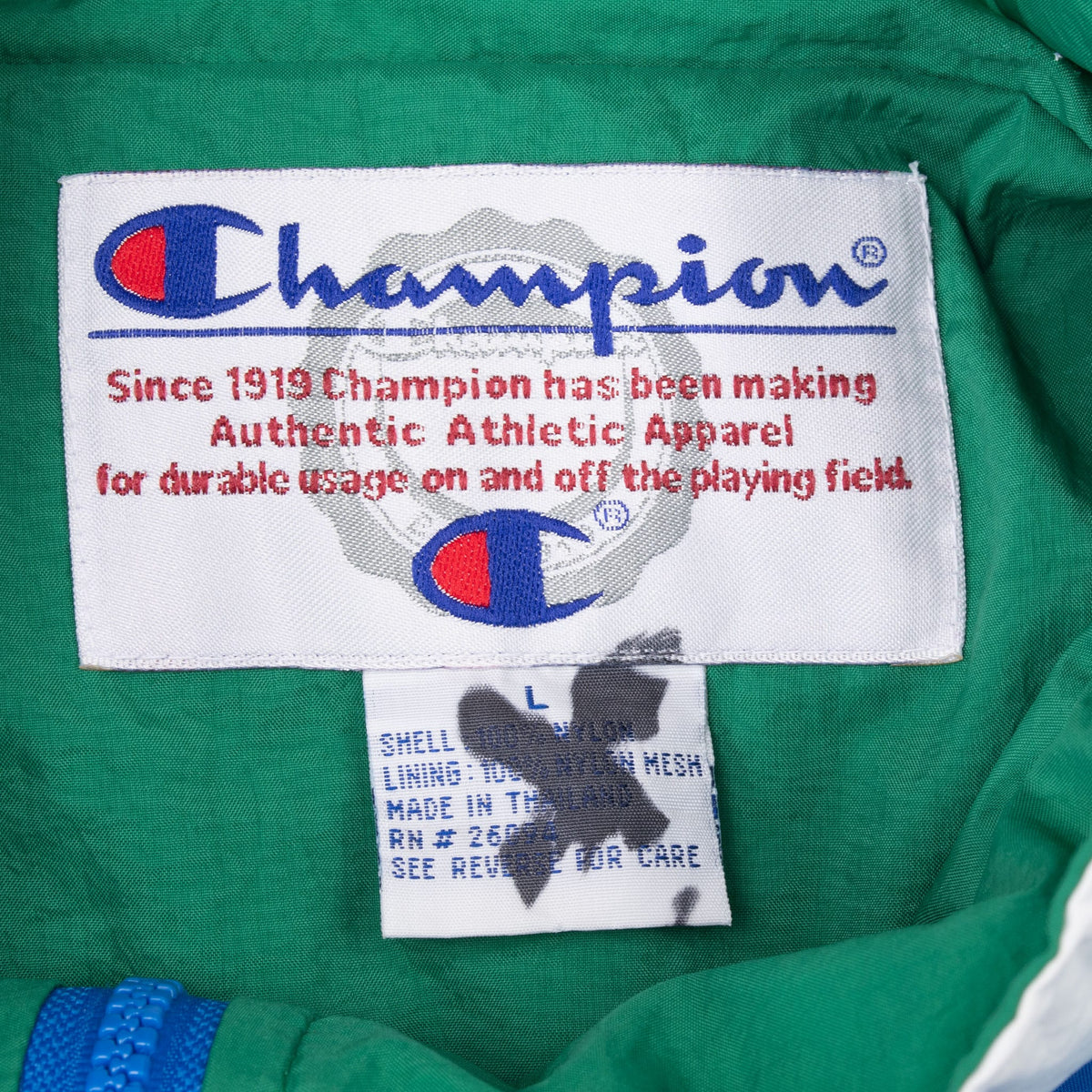 Champion neck label and size large tag inside green collar