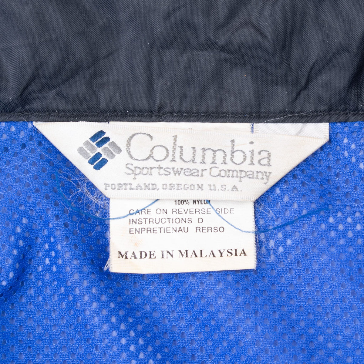 Columbia Sportswear Company neck label inside blue mesh lining