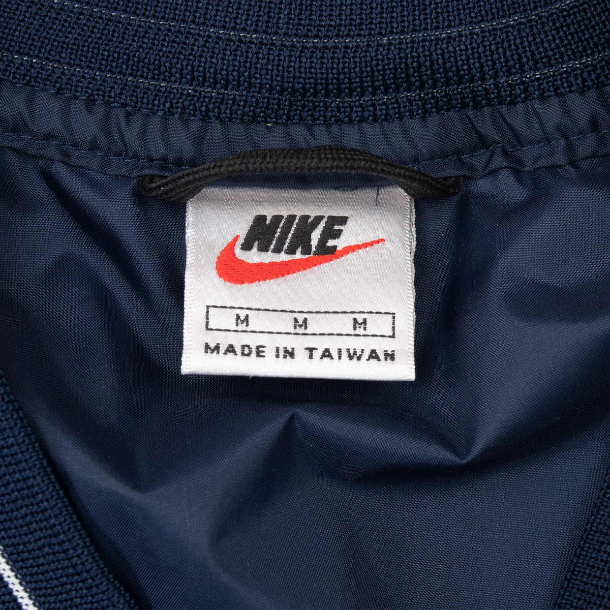 Nike neck label showing medium size and Made in Taiwan text