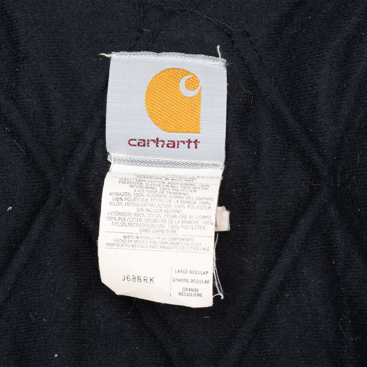 Carhartt interior label showing J68 BRK and large regular sizing