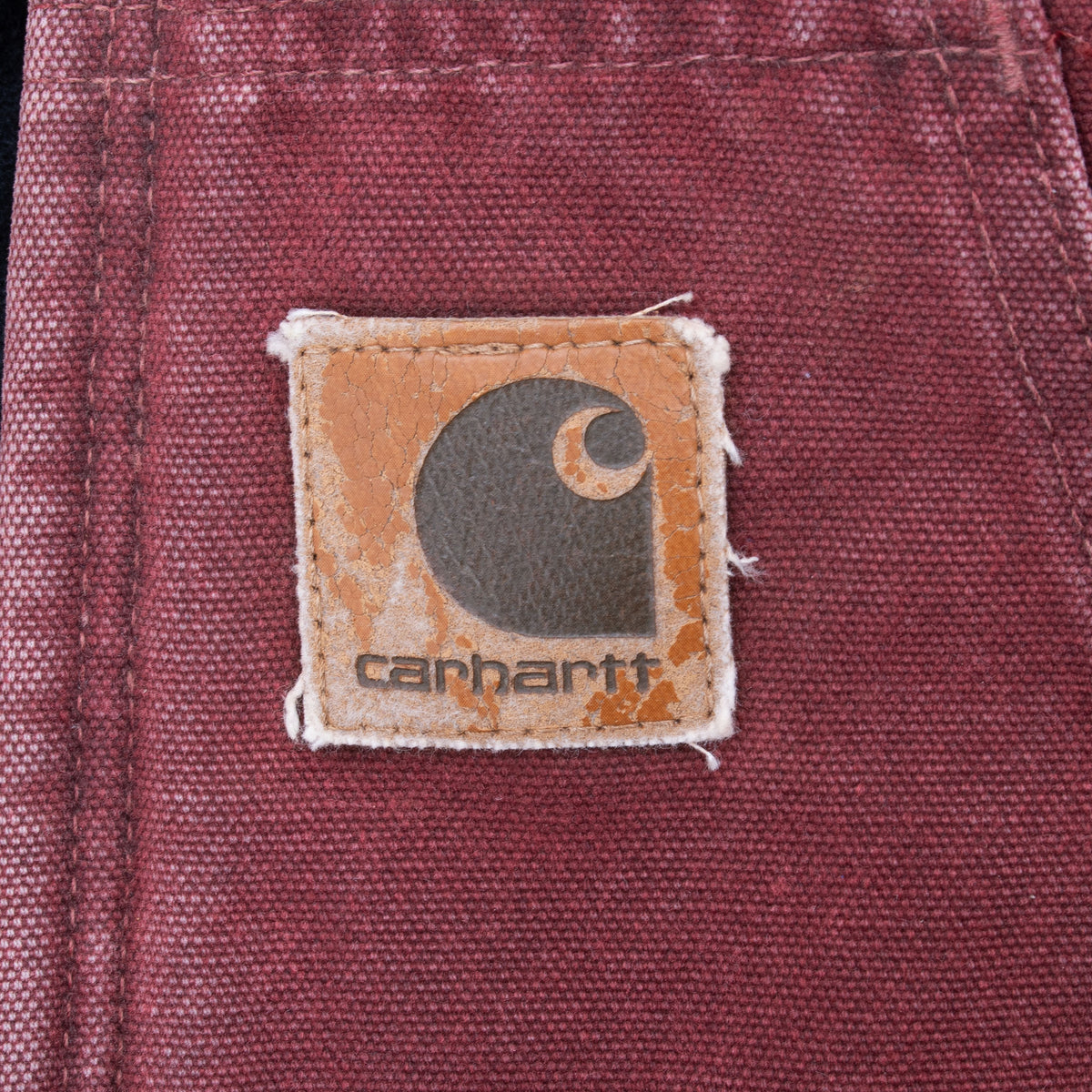 Close-up of Carhartt logo patch on front pocket