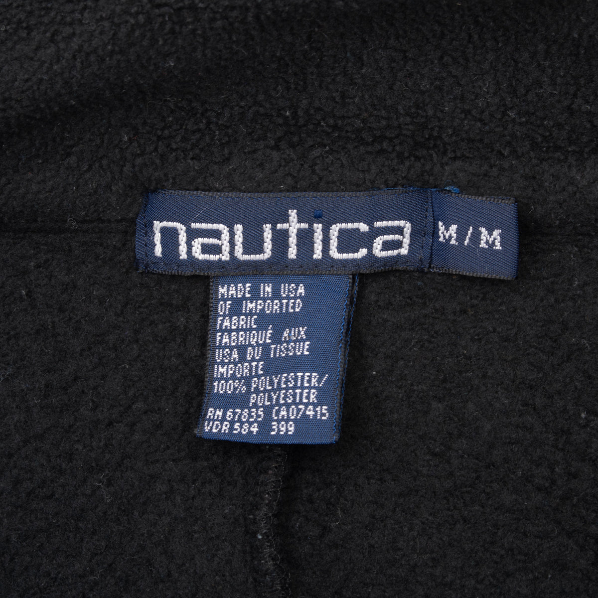 Nautica M/M neck label and care tag on black fleece lining