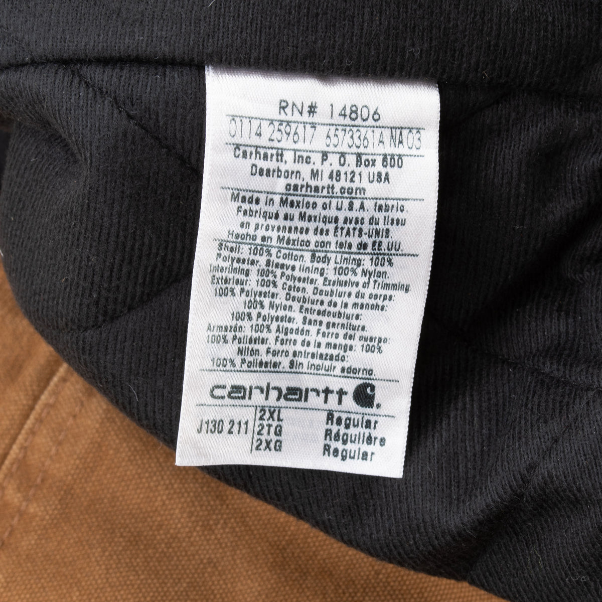 Carhartt care label showing J130 211 style and 2XL regular size