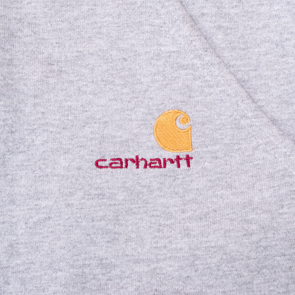 Yellow and red embroidered Carhartt logo on grey front pocket