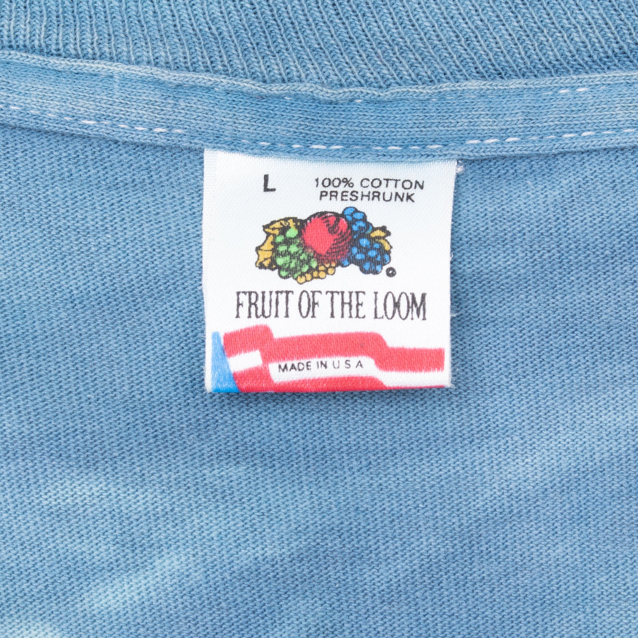 Fruit of the Loom size L neck tag marked 100% cotton, preshrunk and made in USA