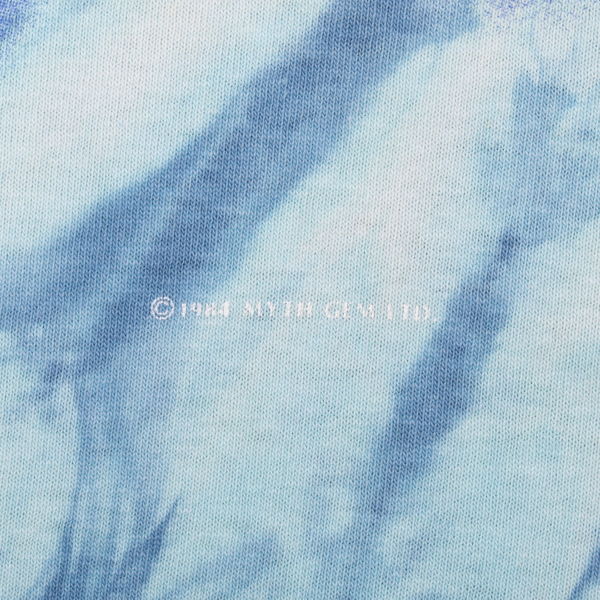 Close-up of copyright text printed on blue tie-dye fabric