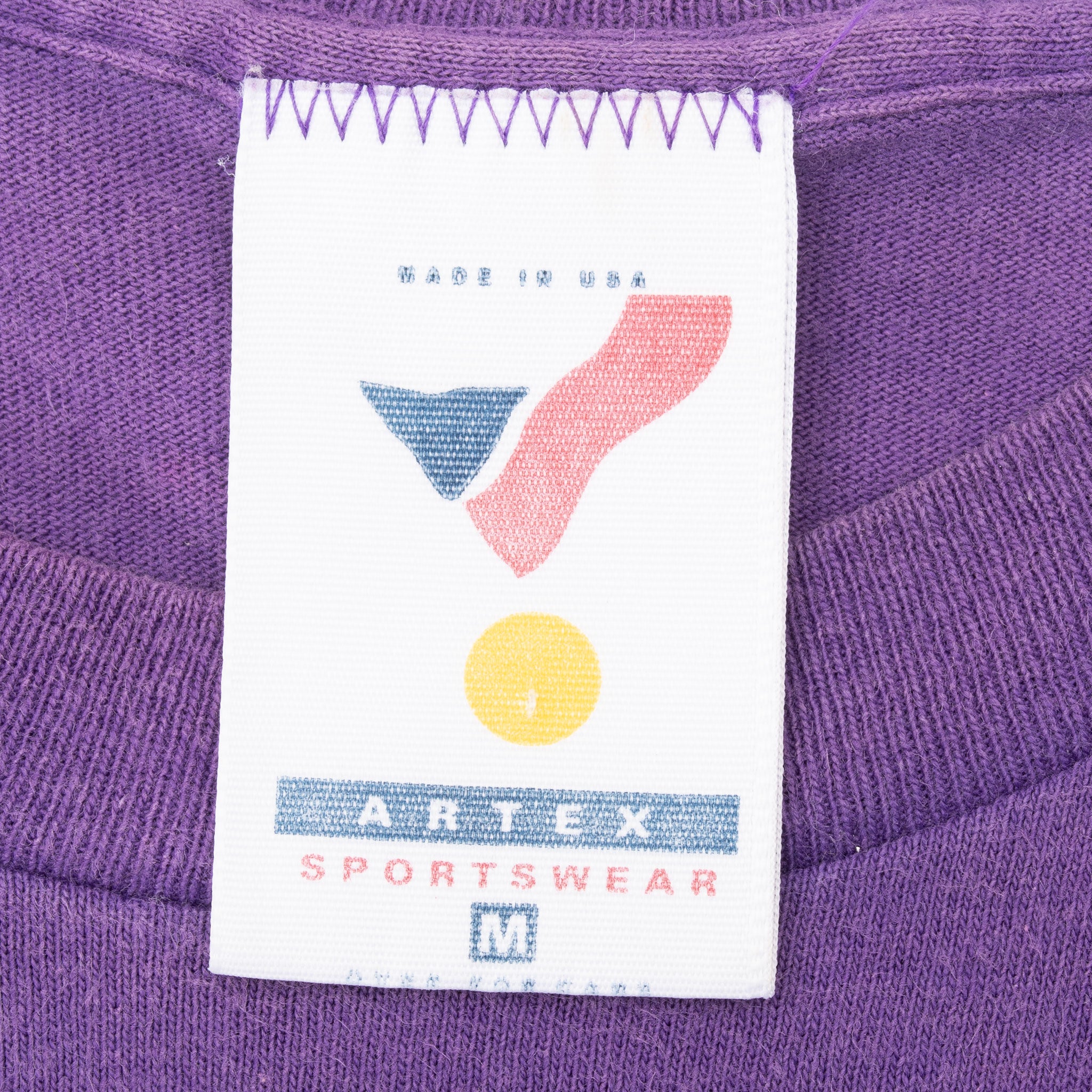 Sportswear neck tag marked medium on purple Utah Jazz T-shirt