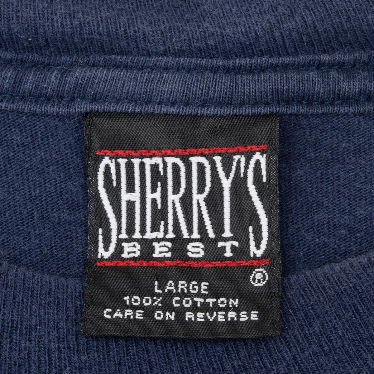 Sherry's Best large 100% cotton neck tag on navy Looney Tunes tee