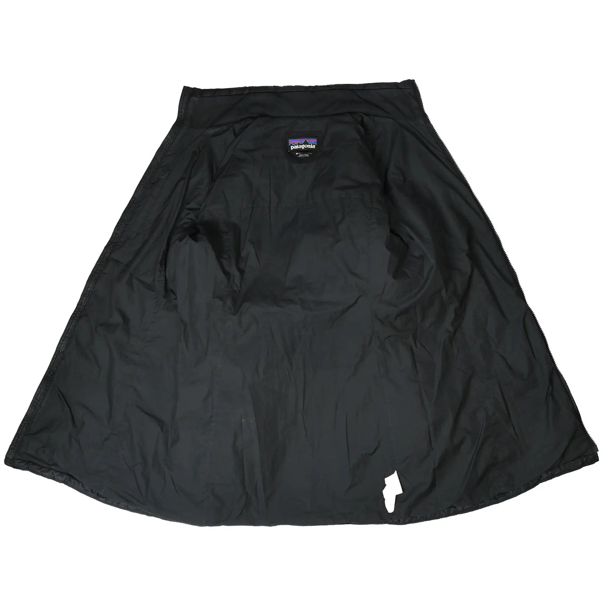 Open interior of black Patagonia Radalie parka showing lining and neck label