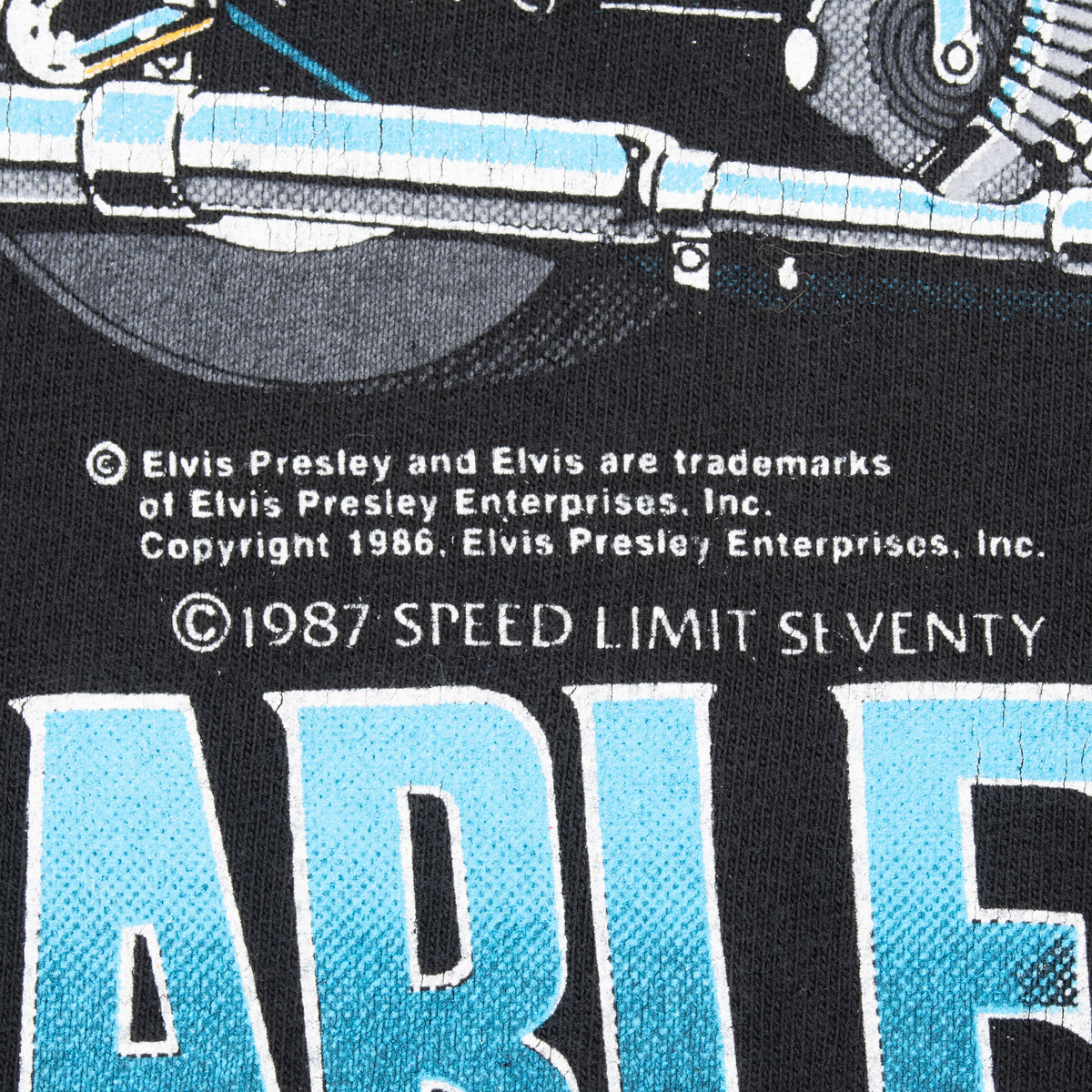 Close-up of front print showing Elvis Presley copyright and 1987 Speed Limit Seventy text