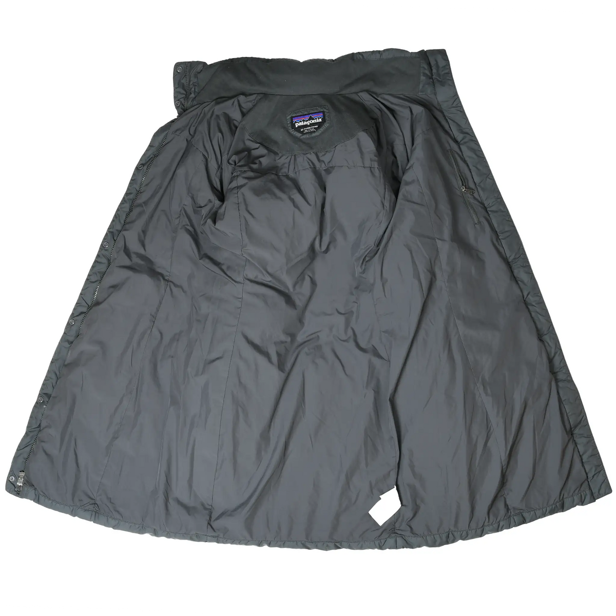Interior view of gray Patagonia parka with lining and neck label