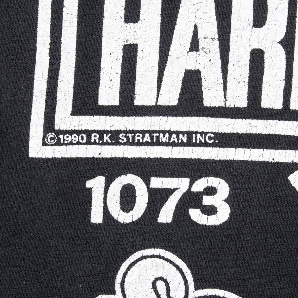 Close-up of back print showing 1990 R.K. Stratman Inc. copyright and 1073 text