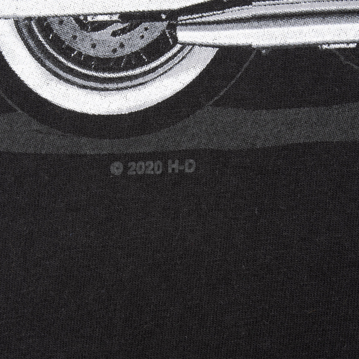 Close-up of small H-D copyright mark below the front motorcycle graphic