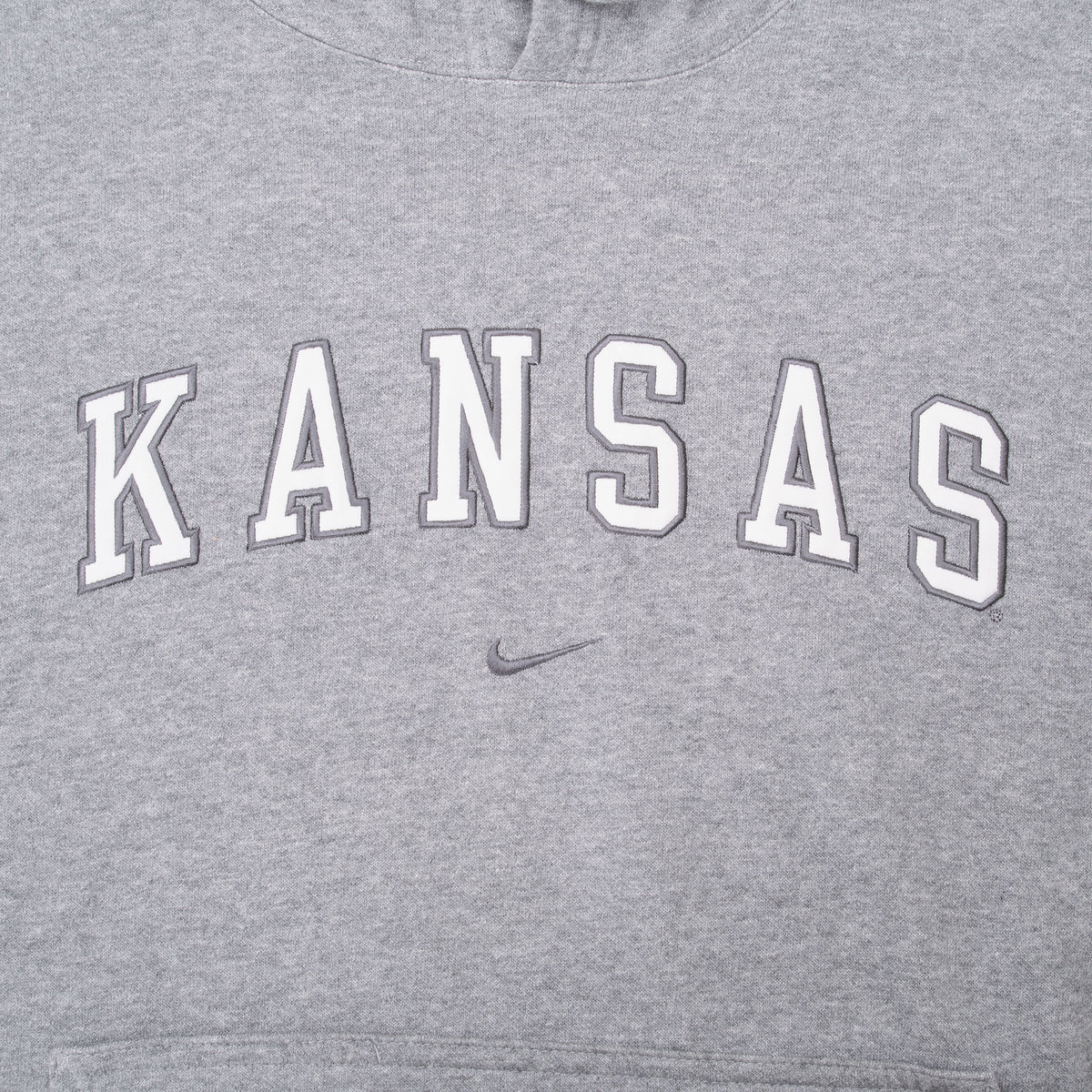 Close-up of Kansas chest lettering and embroidered Nike Swoosh