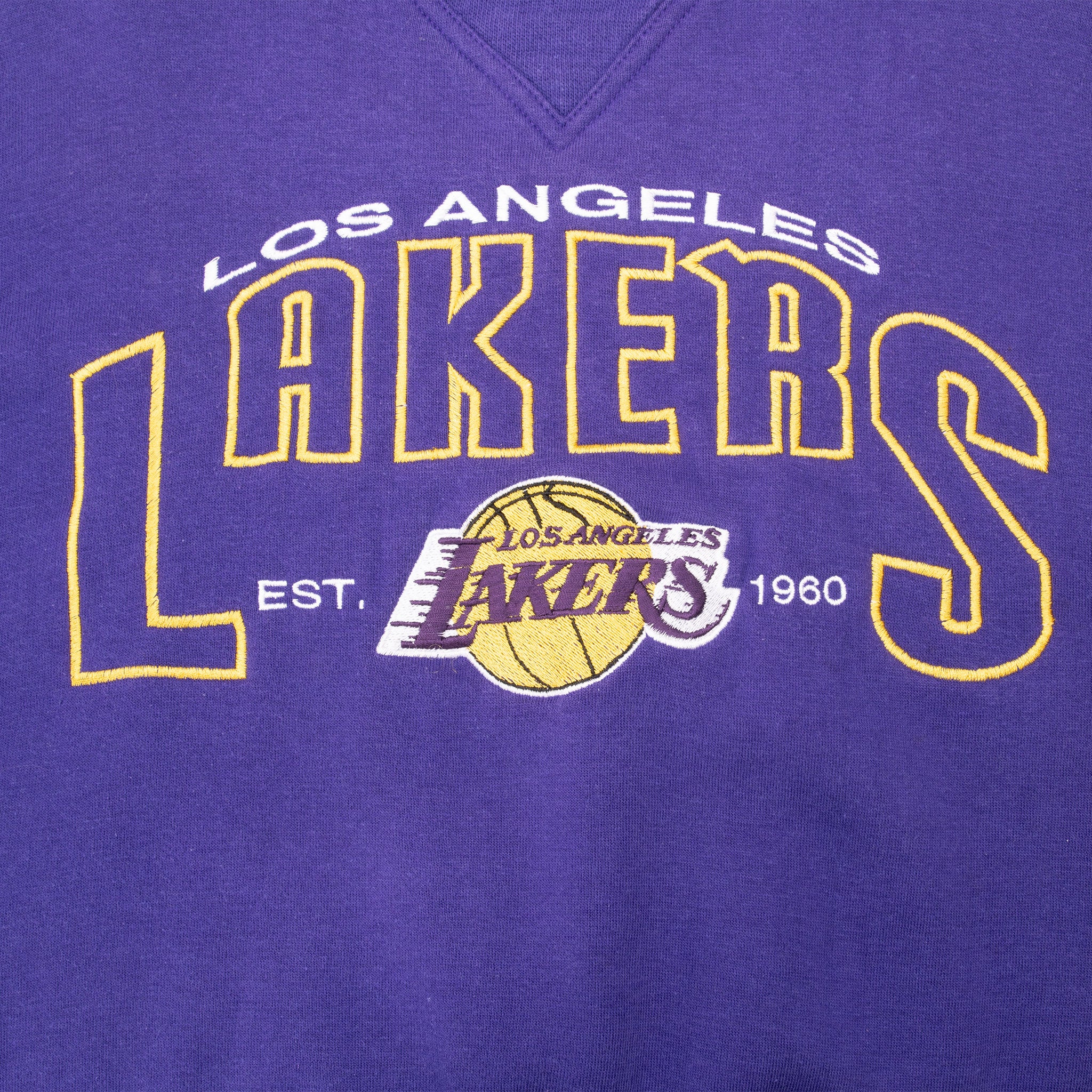 Close-up of embroidered Los Angeles Lakers lettering and basketball logo