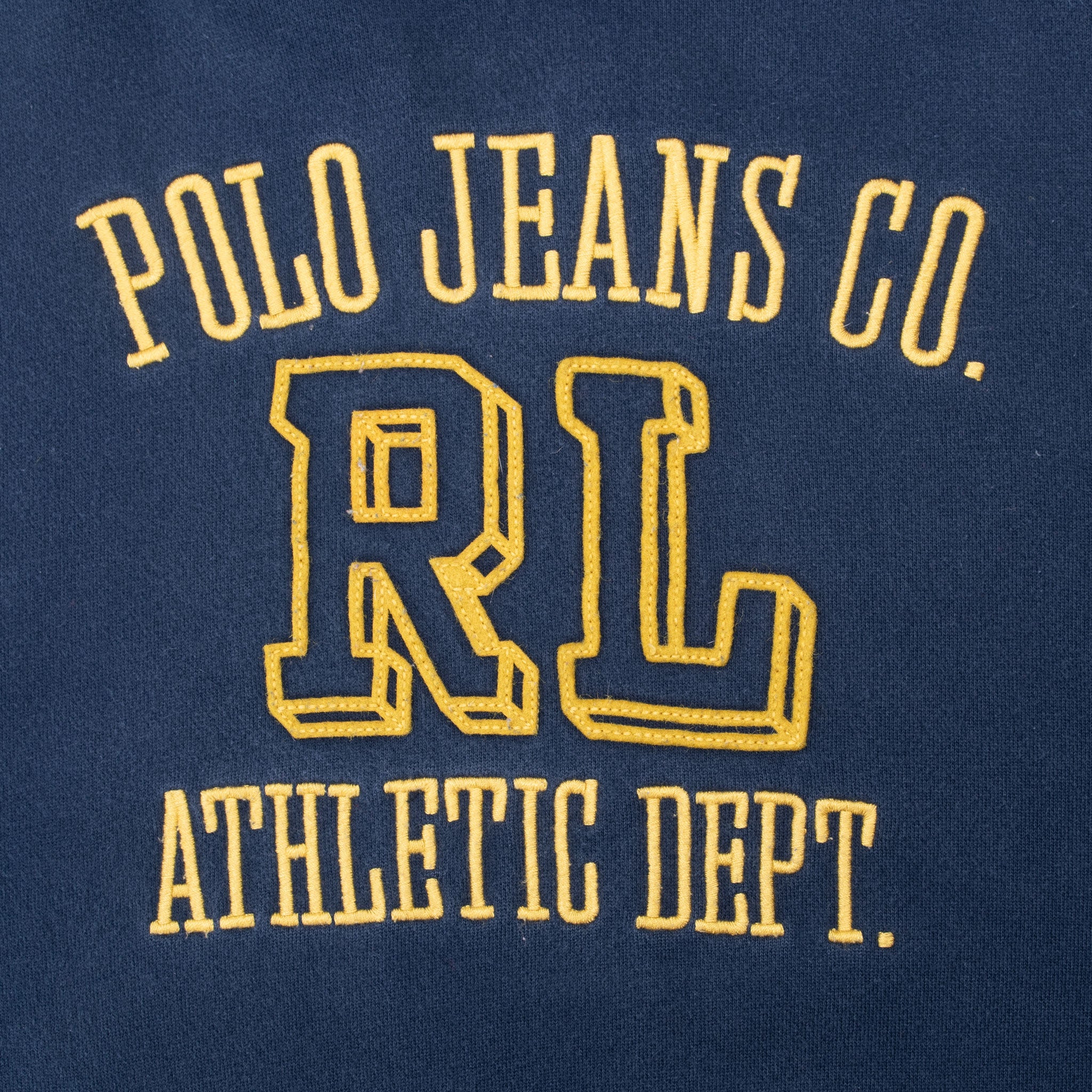 Close-up of yellow Polo Jeans Co. RL Athletic Dept. embroidery on navy hoodie