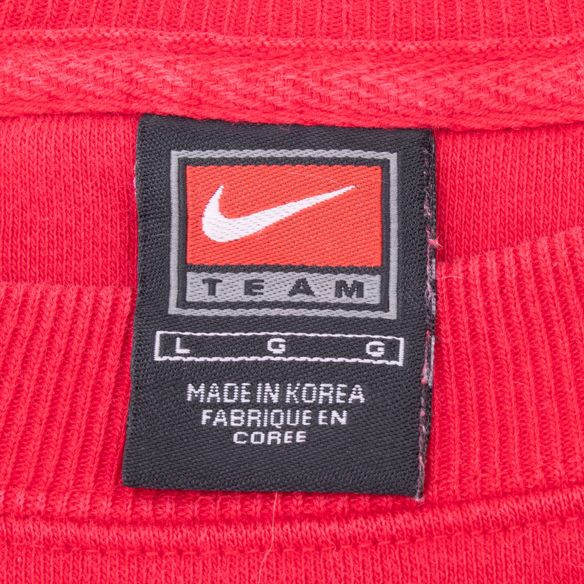 Nike Team neck label showing size large and Made in Korea