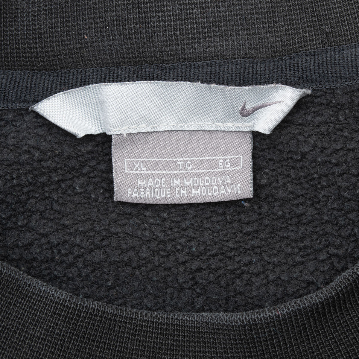 Nike neck and size XL label inside black sweatshirt