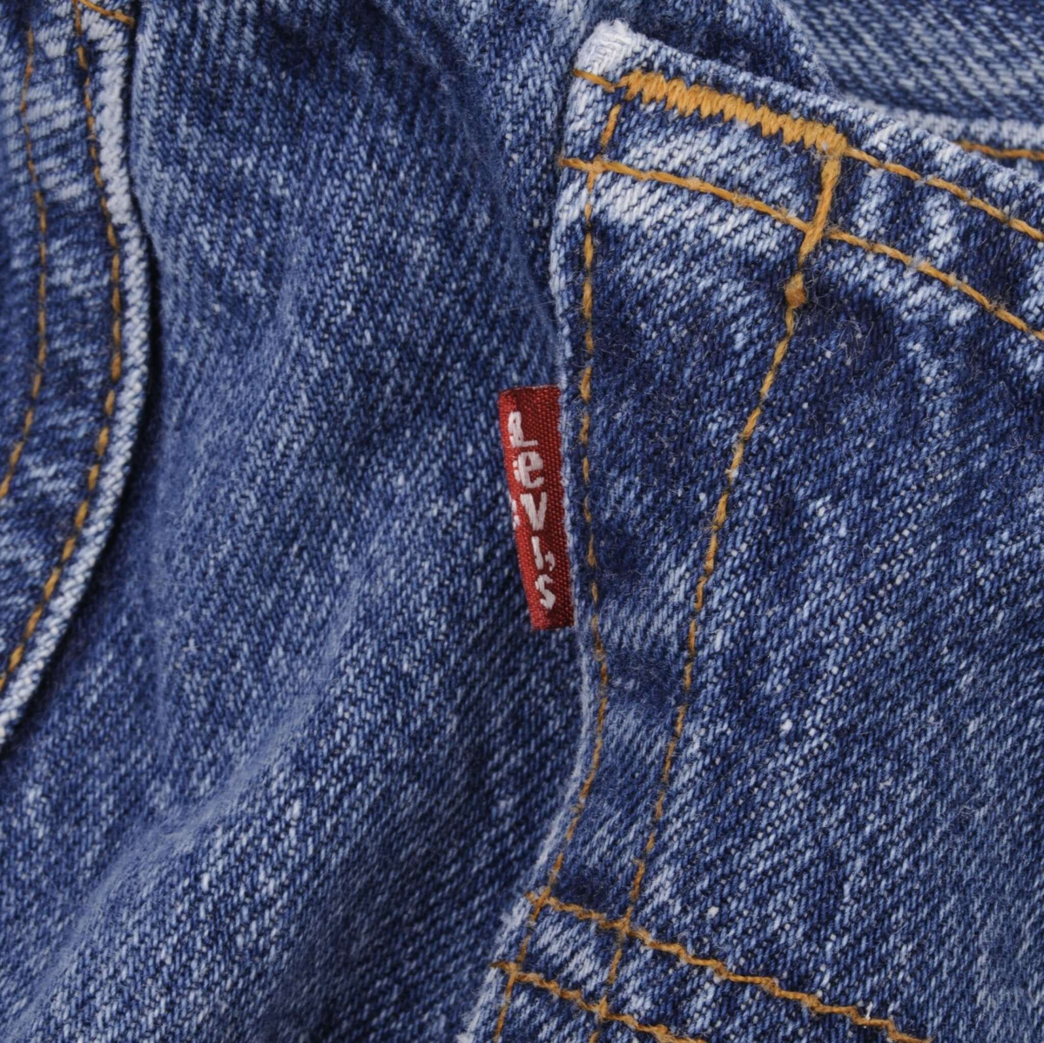 Beautiful Indigo Levis 501 jeans 1980s Made in USA with Medium Wash.  Size on tag 35X32 Actual Size 32X28  Back Button #522