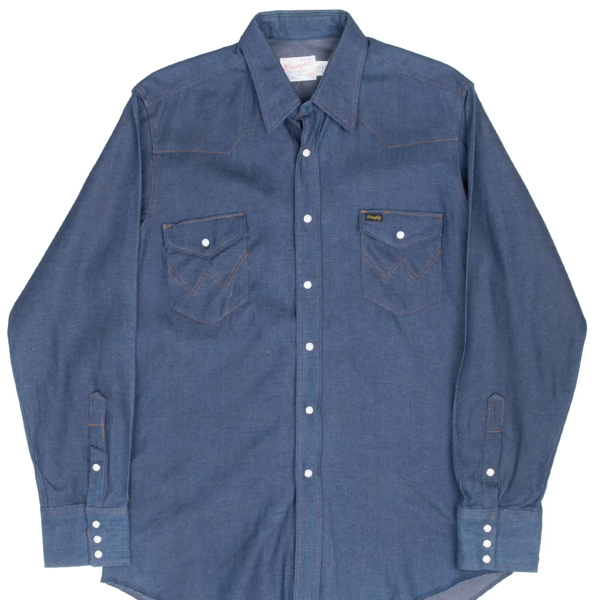 Front of blue Wrangler denim shirt with pearl snaps and two flap chest pockets