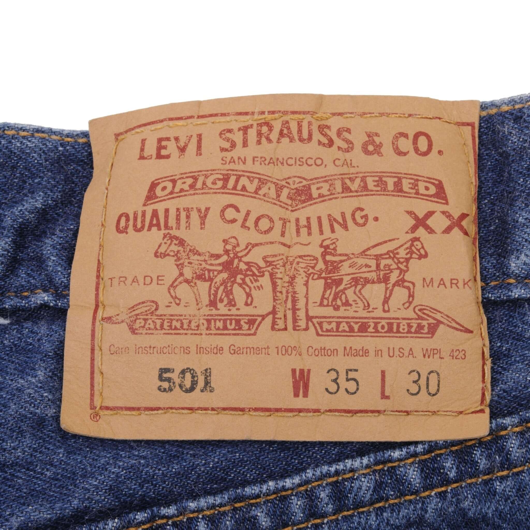 Beautiful Indigo Levis 501 Jeans 1990s Made in USA with Medium Dark Wash. Size on tag 35X30 Actual Size 34X29 Back Button #524A