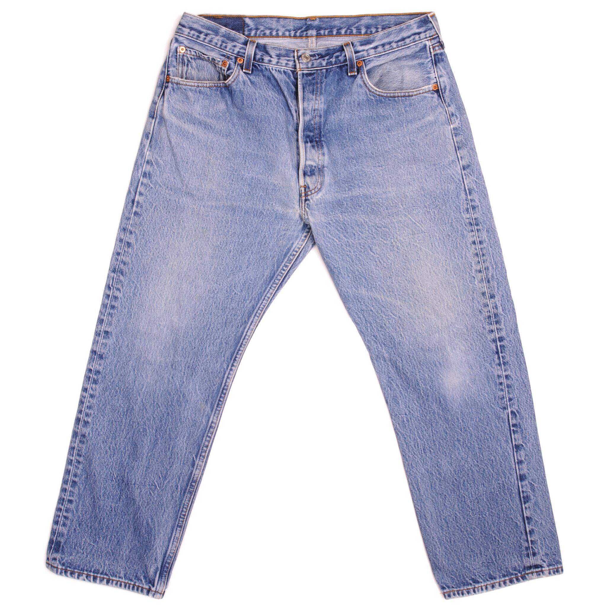 Beautiful Indigo Levis 501 Jeans 1990s Made in USA with a light blue wash, a very nice contrast between light and medium blue and some light whiskers. Size 34x26 Back Button #555
