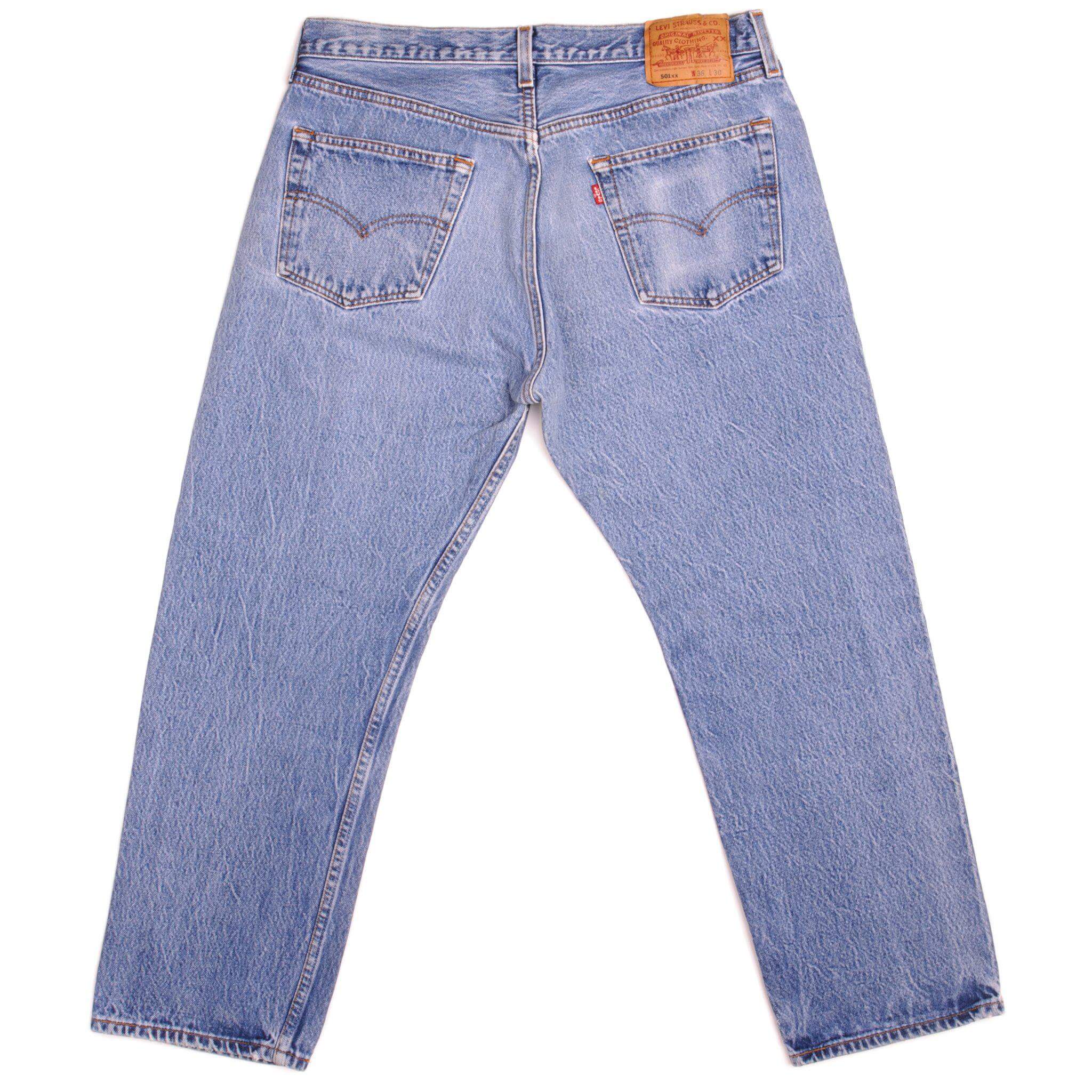 Beautiful Indigo Levis 501 Jeans 1990s Made in USA with a light blue wash, a very nice contrast between light and medium blue and some light whiskers. Size 34x26 Back Button #555