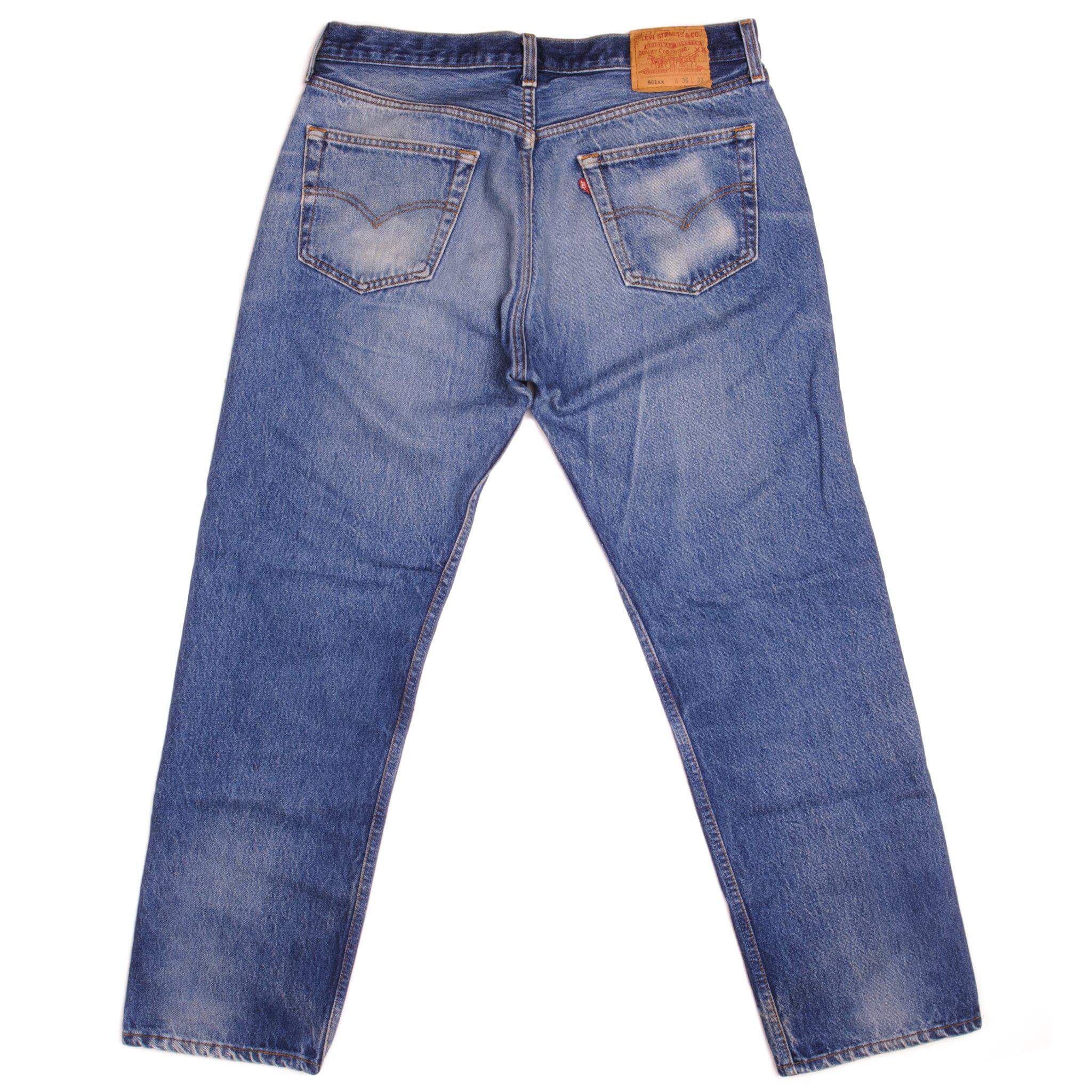 Beautiful Indigo Levis 501 Jeans 1990's Made in USA with a medium blue wash, a nice contrast between light and medium blue and some strong whiskers. Size 35x29 Back Button #524M