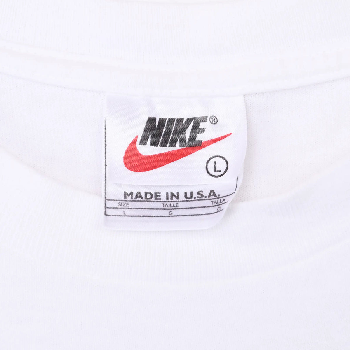 Nike neck tag showing size large and Made in U.S.A.