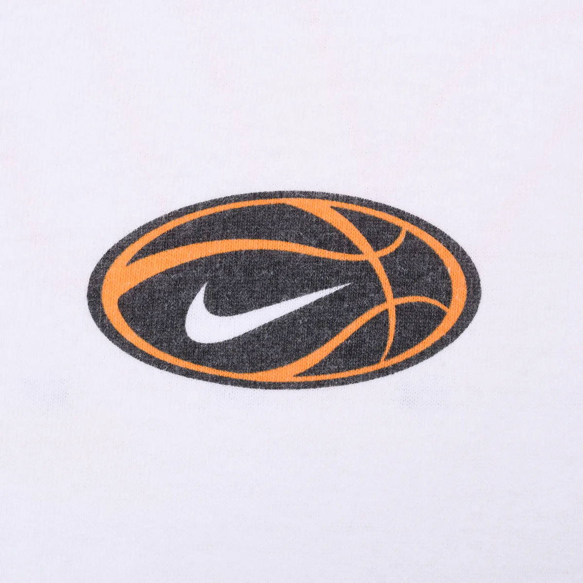 Close-up of black and orange basketball graphic with white Nike Swoosh