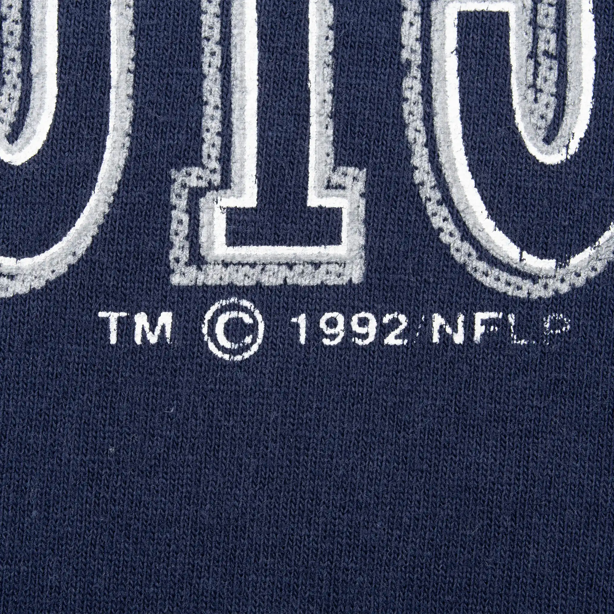 Close-up of 1992 NFL copyright mark beneath the Dallas Cowboys print