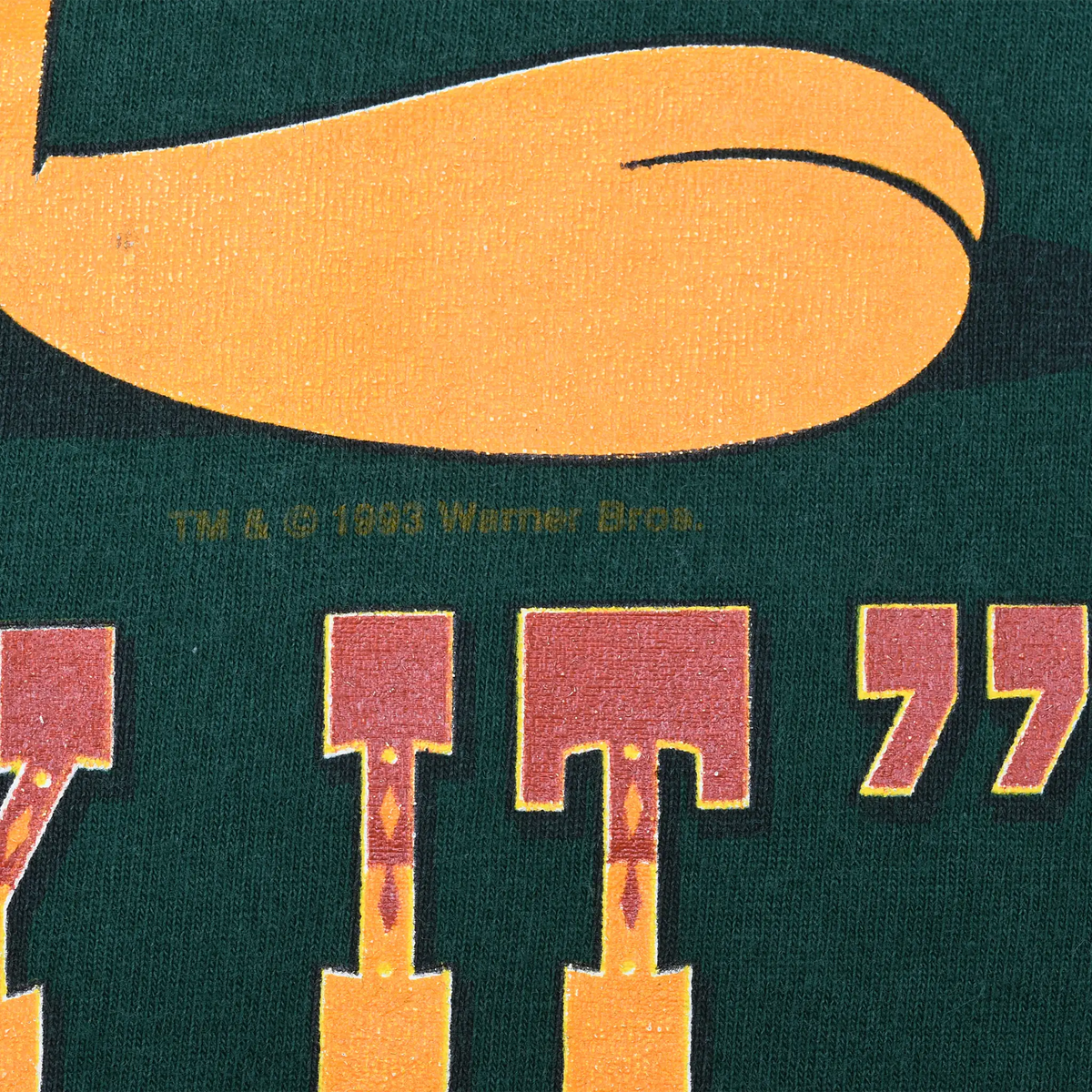 Close-up of “TWY IT” print and 1993 Warner Bros. copyright mark