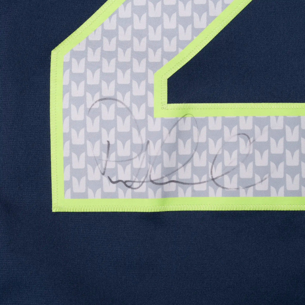 Close-up of signature on silver front number 29 with bright green trim