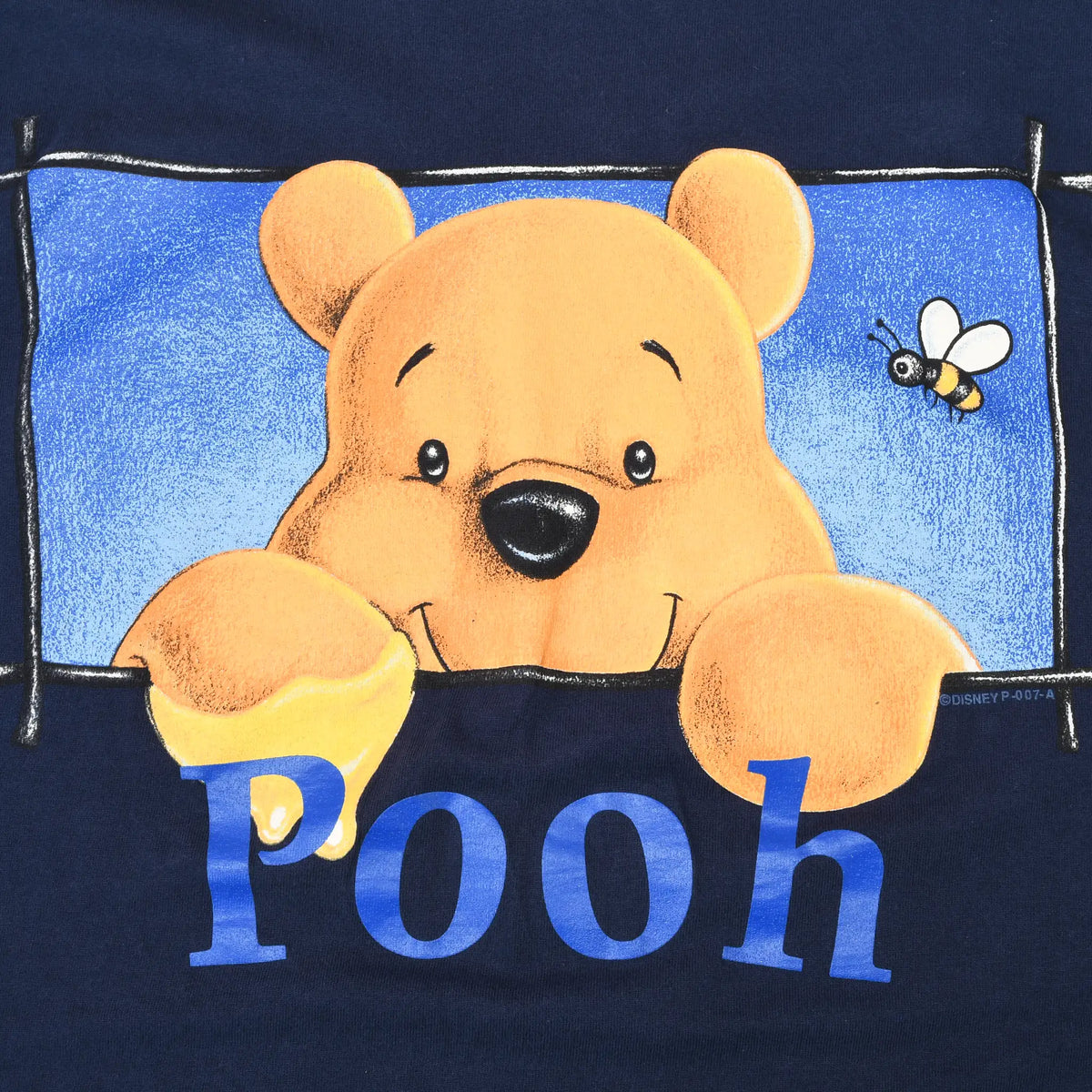 Close-up of Winnie the Pooh and bee front graphic with blue Pooh lettering
