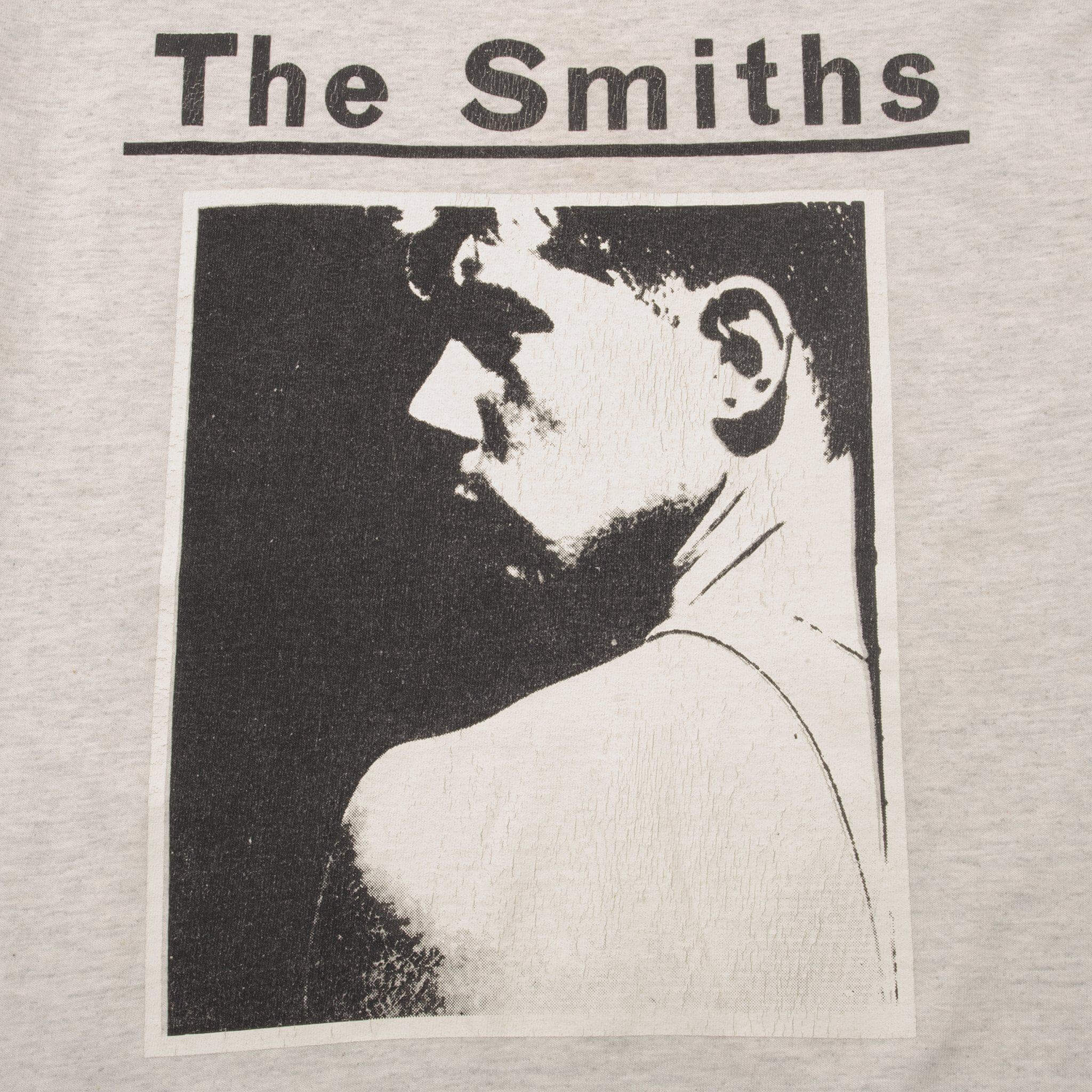 Close-up of The Smiths black portrait print on heather gray fabric