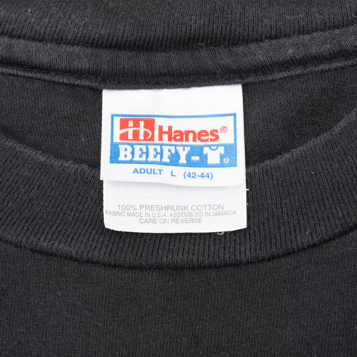 Hanes Beefy-T neck tag marked adult large on black T-shirt