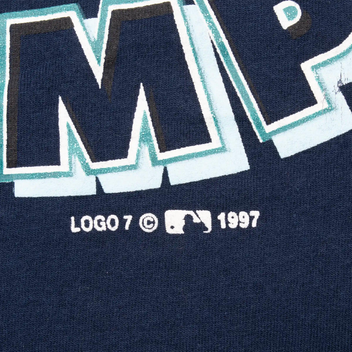 Close-up of MLB logo and 1997 copyright beneath the Mariners print