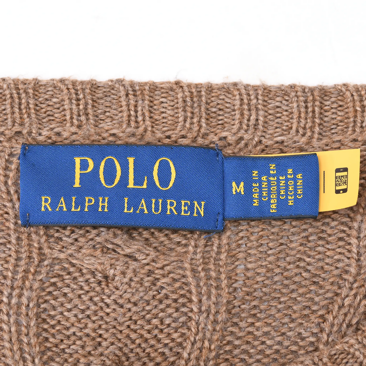 Polo Ralph Lauren neck label and medium size tag inside brown cable-knit sweater