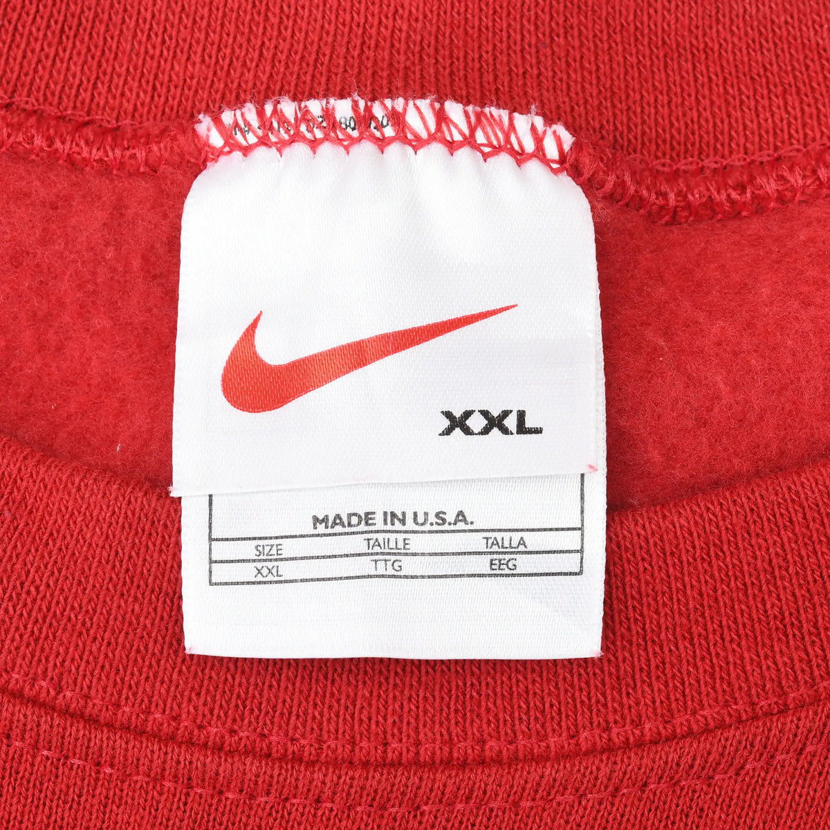 Nike neck tag showing red Swoosh, XXL size, and Made in USA text