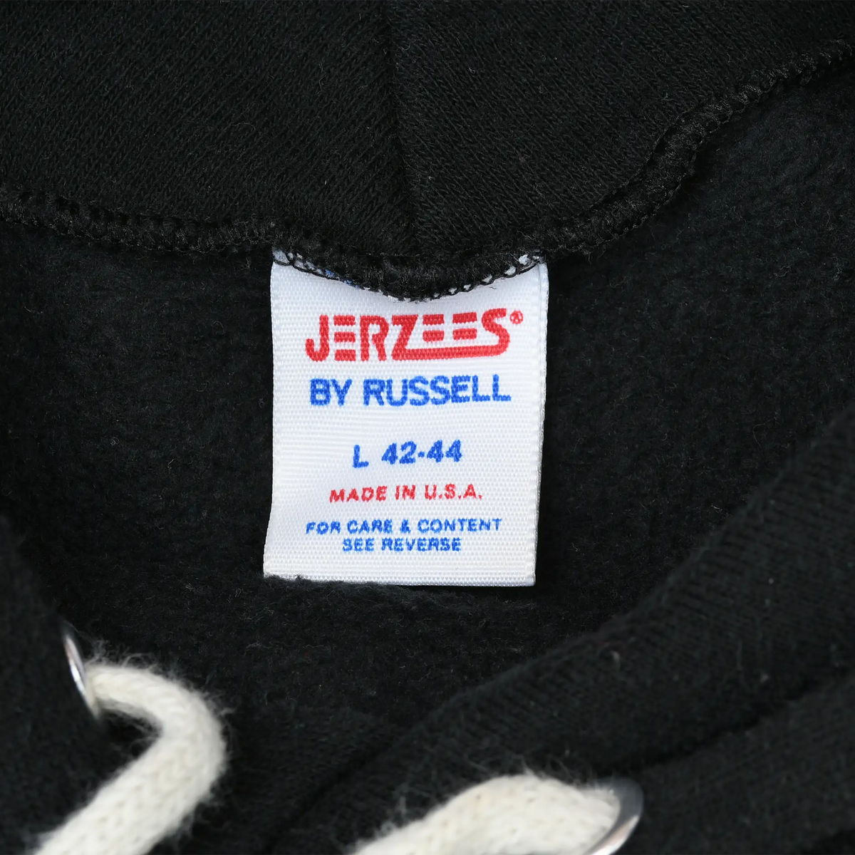 Jerzees by Russell neck tag marked large 42–44 and Made in U.S.A.