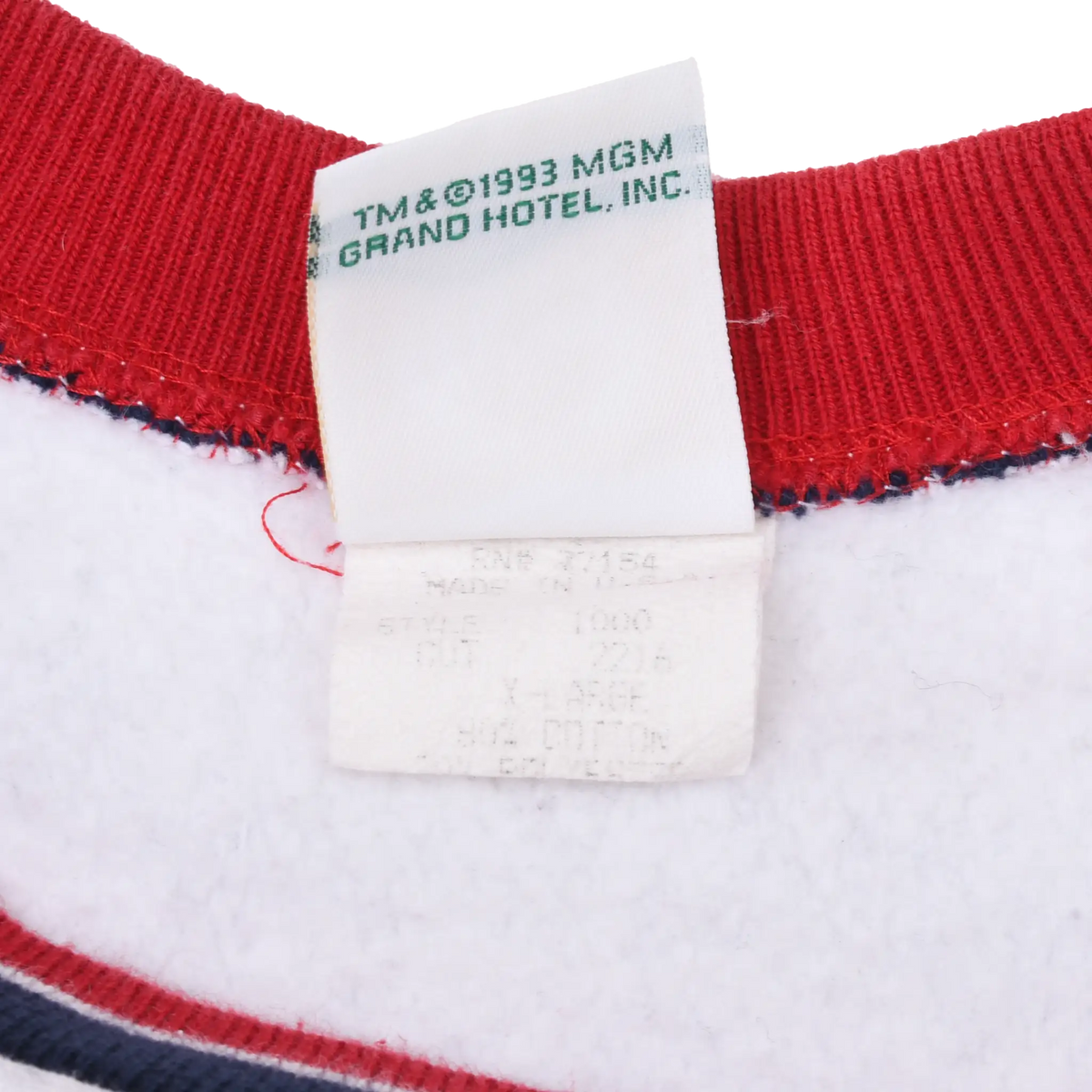 Neck tag detail with ©1993 MGM Grand Hotel, Inc. text and faded care label