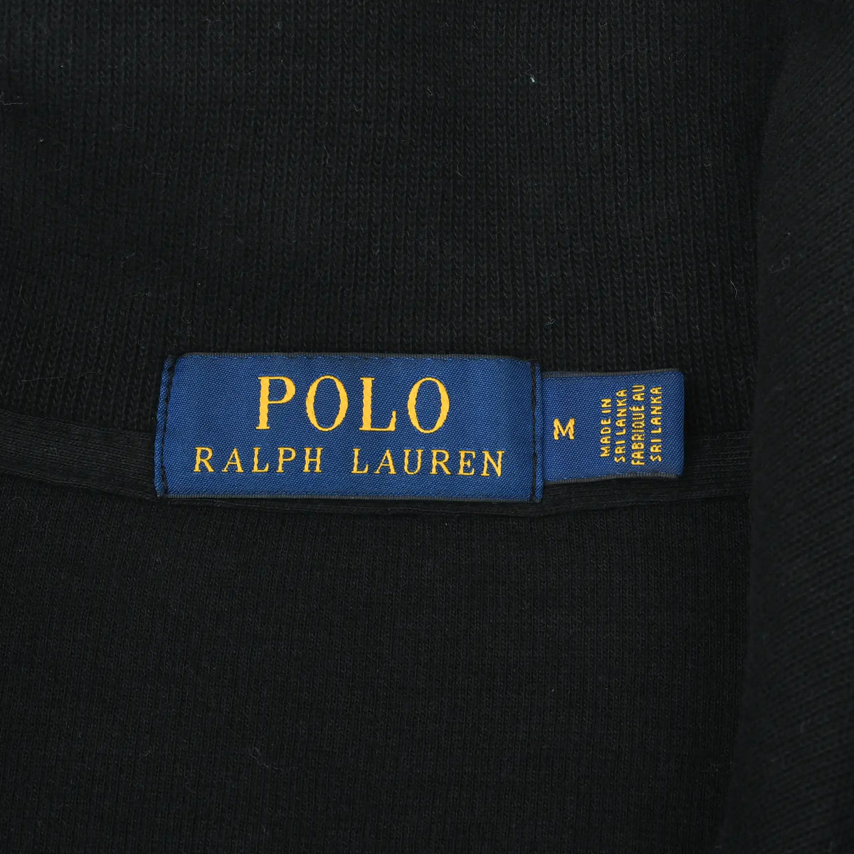 Polo Ralph Lauren neck label with medium size tag on black sweater