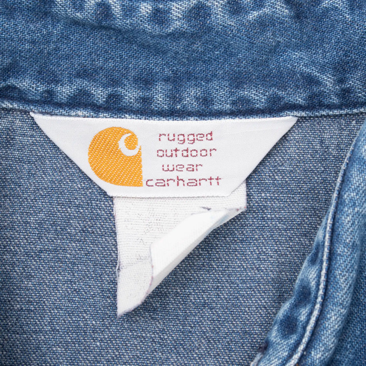 Carhartt Rugged Outdoor Wear collar label inside blue denim shirt