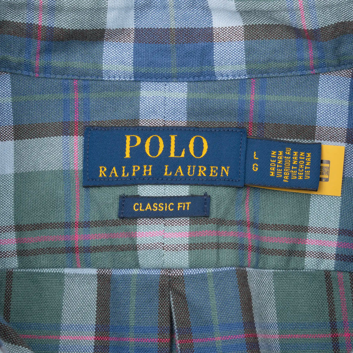 Polo Ralph Lauren neck label and Classic Fit tag on plaid shirt