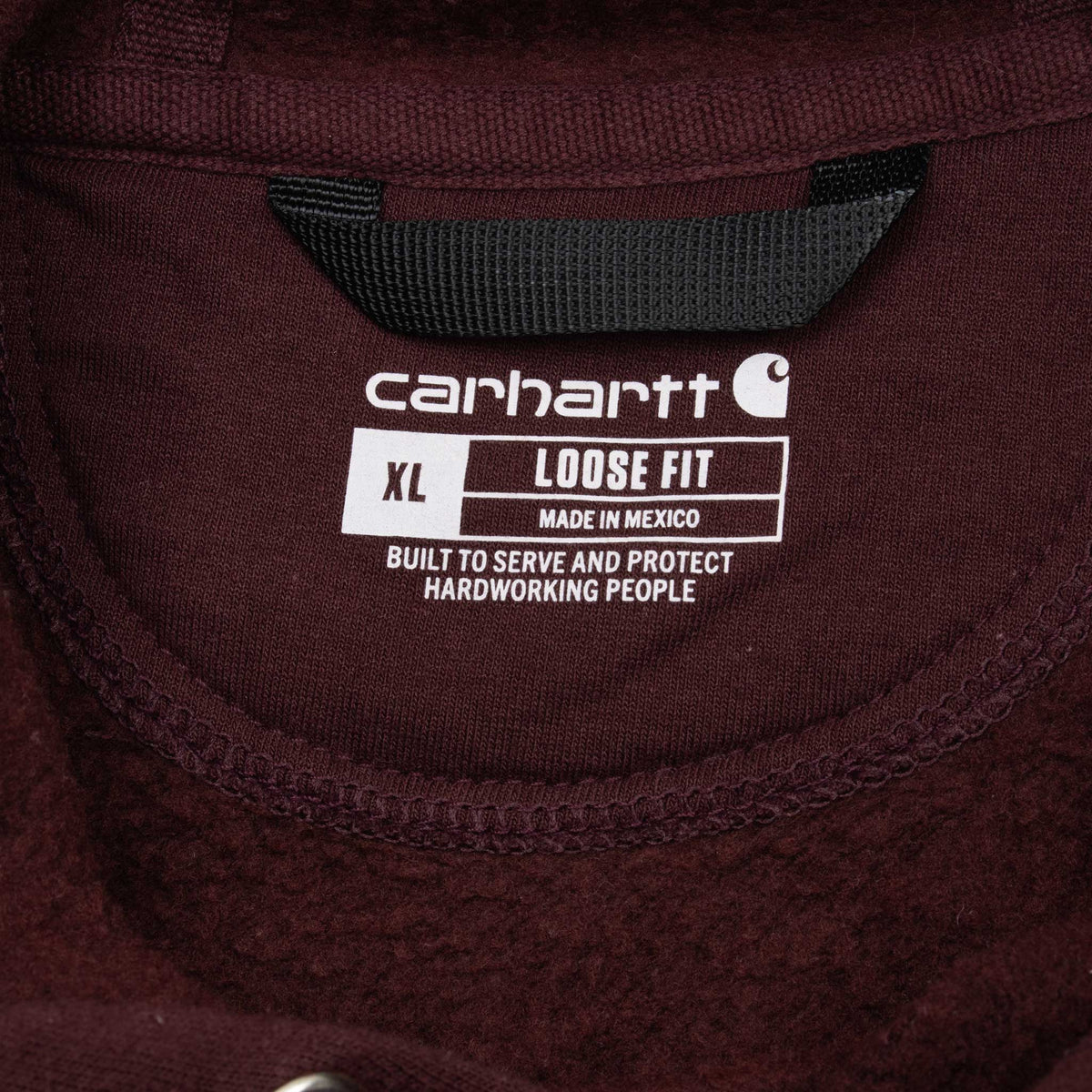 Carhartt neck print showing XL, loose fit and Made in Mexico