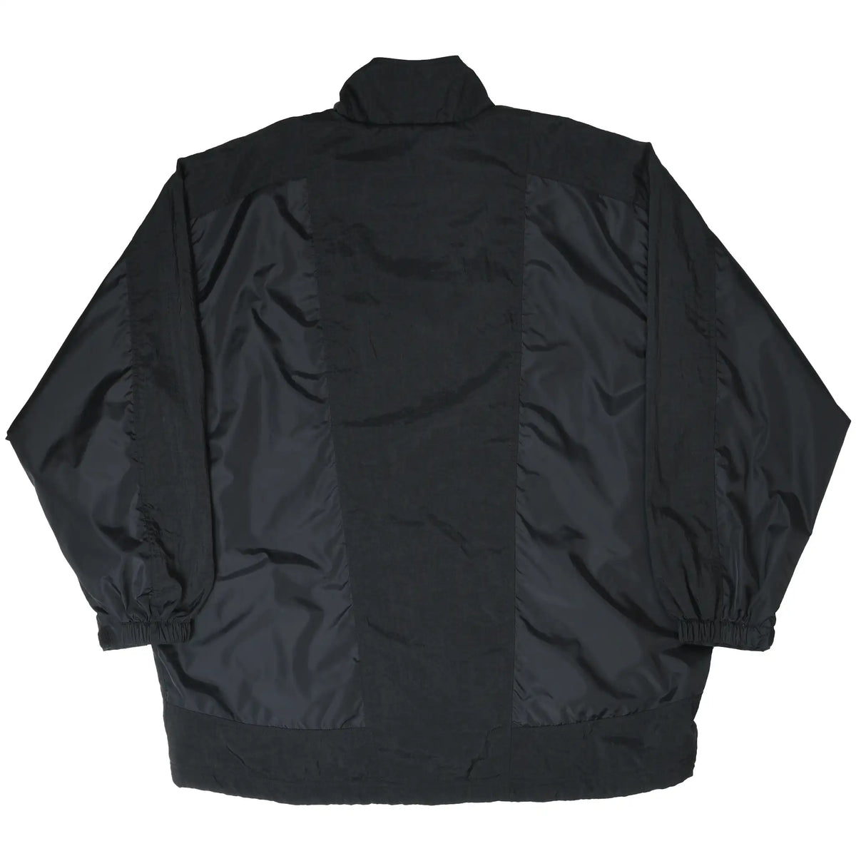 Back of black Nike windbreaker jacket with paneled design and elastic cuffs