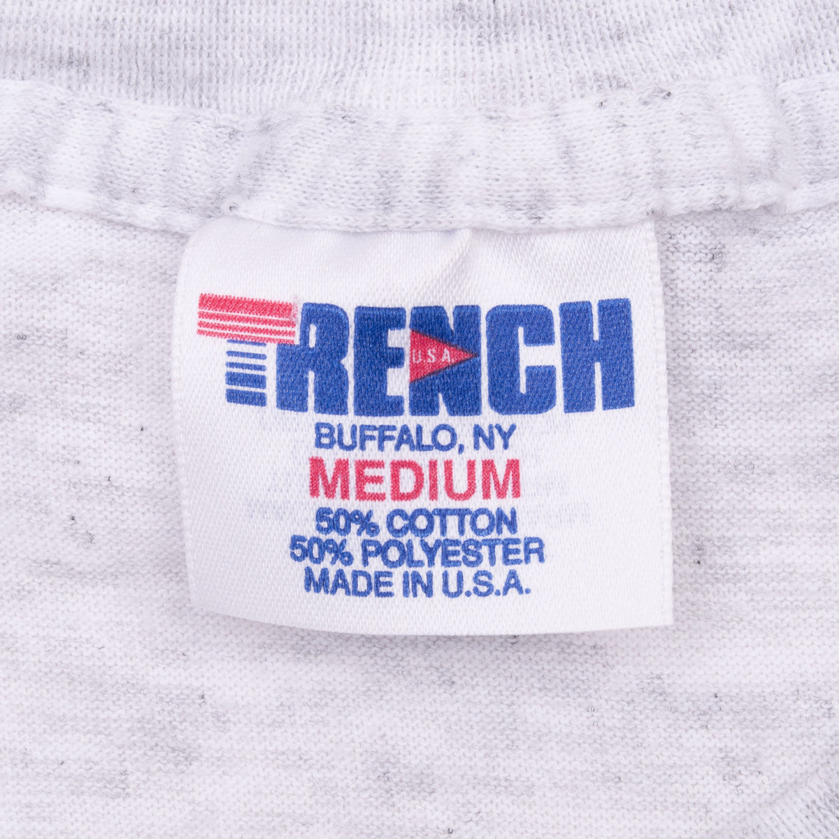 Reach neck tag showing medium, 50% cotton and 50% polyester, made in USA