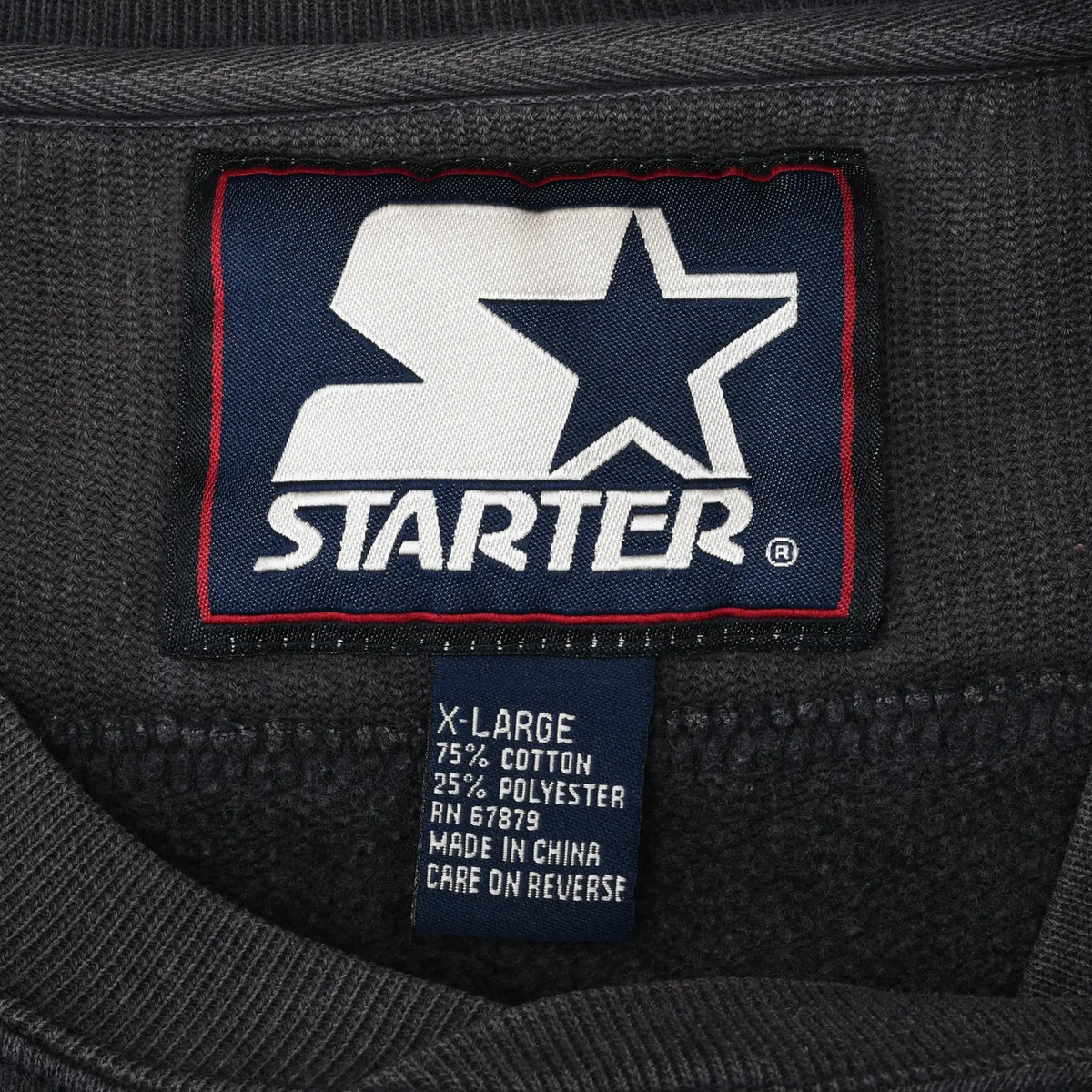 Close-up of Starter neck label and X-Large care tag inside sweatshirt