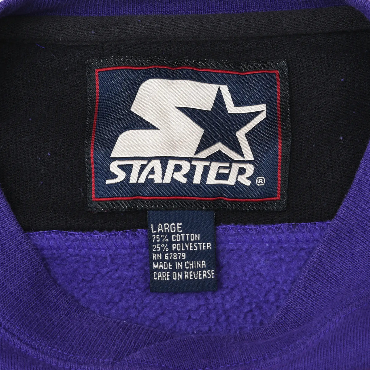 Starter neck label and large size tag inside purple Minnesota Vikings sweatshirt