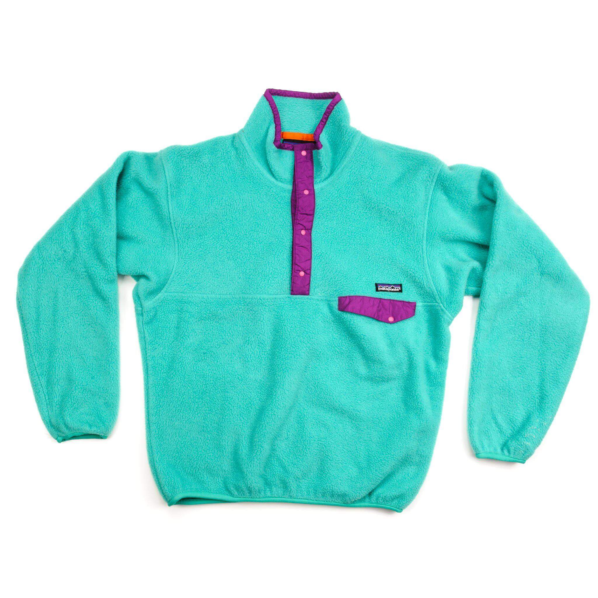 Front view of turquoise Patagonia Snap-T fleece pullover with purple trim and chest pocket